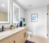Elegant Bathrooms with LED Mirrors at The Marc Luxury Apartments in Palm Beach Gardens FL