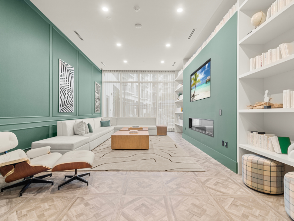 Library with Fireside Seating at The Marc Luxury Apartments in Palm Beach Gardens FL